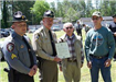 Officer holding plaque